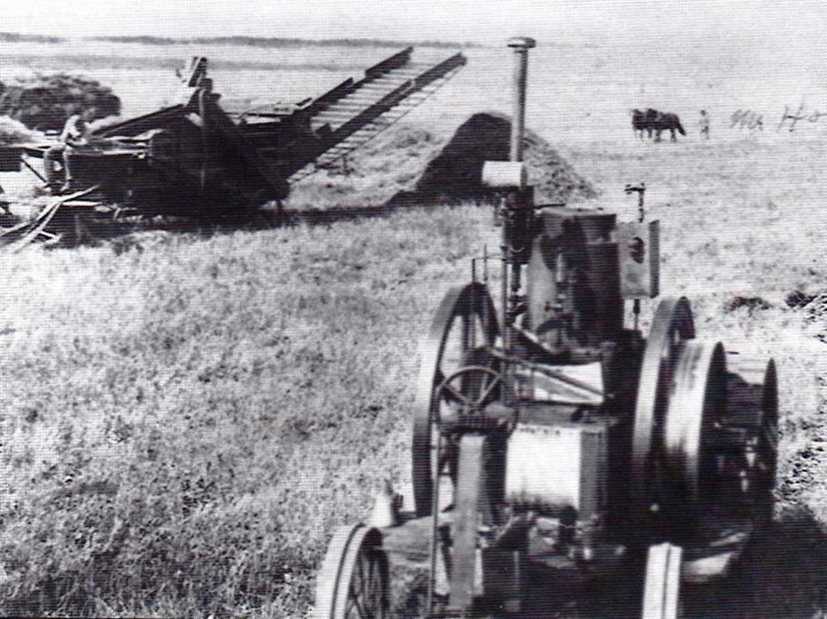 John Froelich and his threshing crew